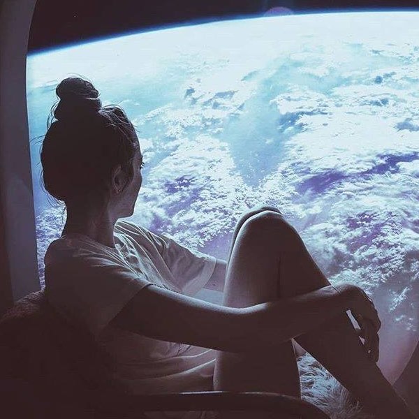 girl through plane window from space with love
